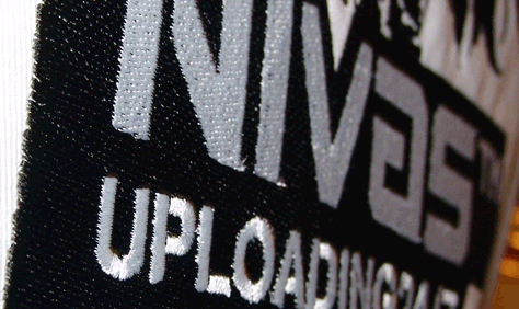 Lab coat Nivas Eagle full logo detail